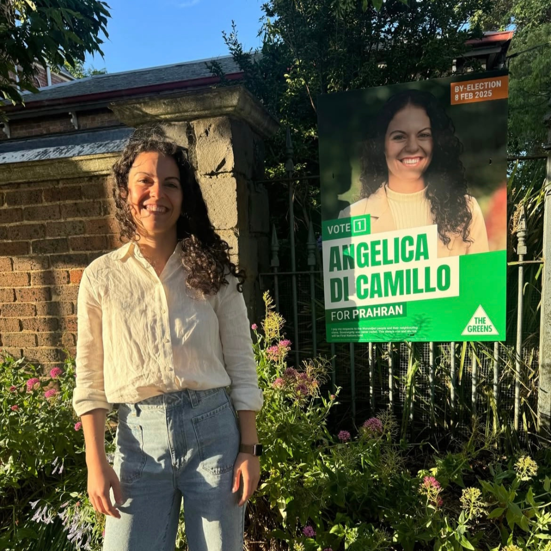 Picture of Angelica Di Camillo with a placard of her ahead of Prahran By-Election