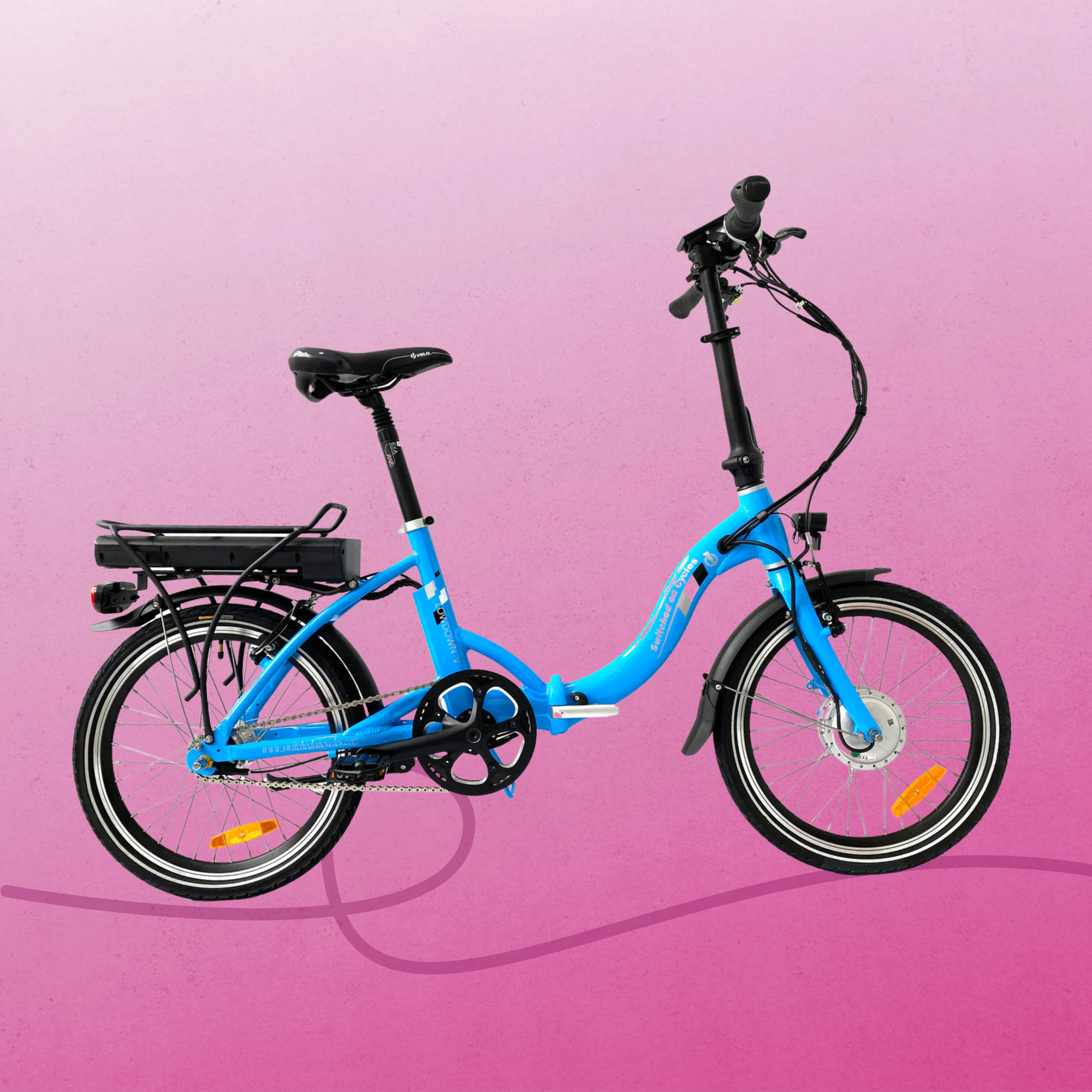 Blue folding electric bicycle on a bright pink background