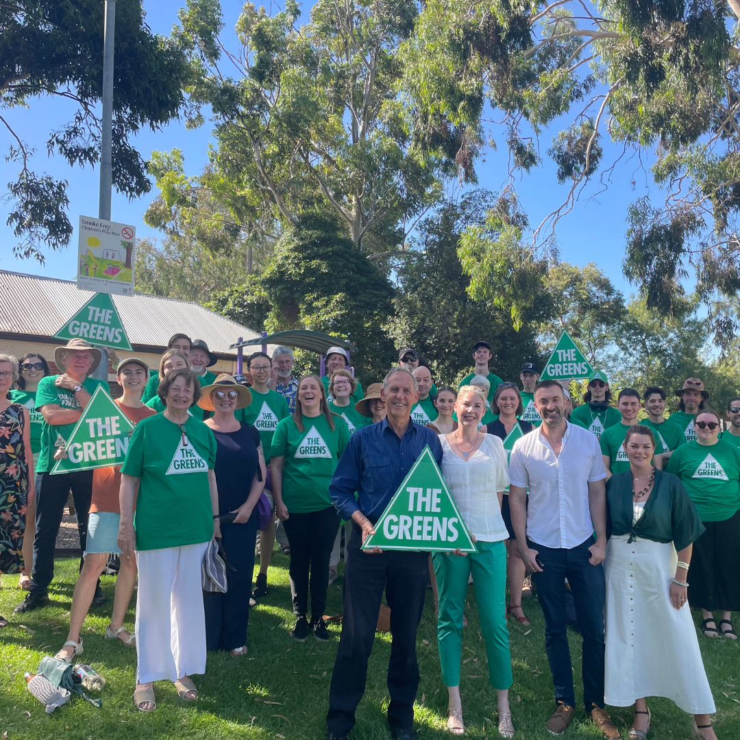 Katie McCusker, Bob Brown and Greens Supporters and Volunteers smiling 