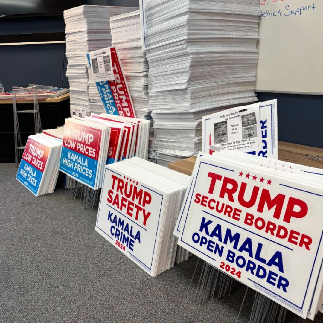 Picture of trump placard which reads 'trump secure border, kamala open border' and 'trump safety, kamala crime'