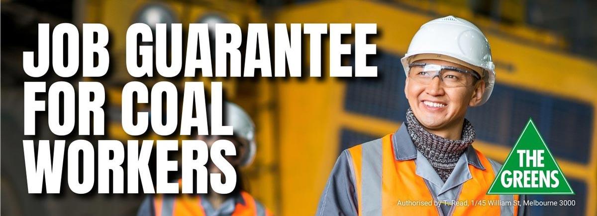 Large white text says: Job guarantee for coal workers. In the bottom right corner is a Greens logo. In the background two workers in orange high-vis vests and hard hats are walking towards the camera and smiling.