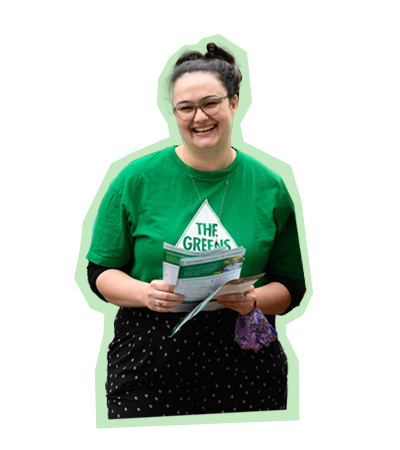 Greens volunteer holding a pamphlet