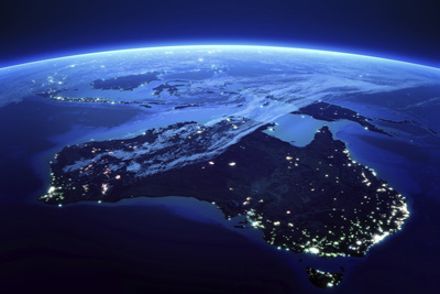 Image of Australia viewed from above at night — lots of electric lights